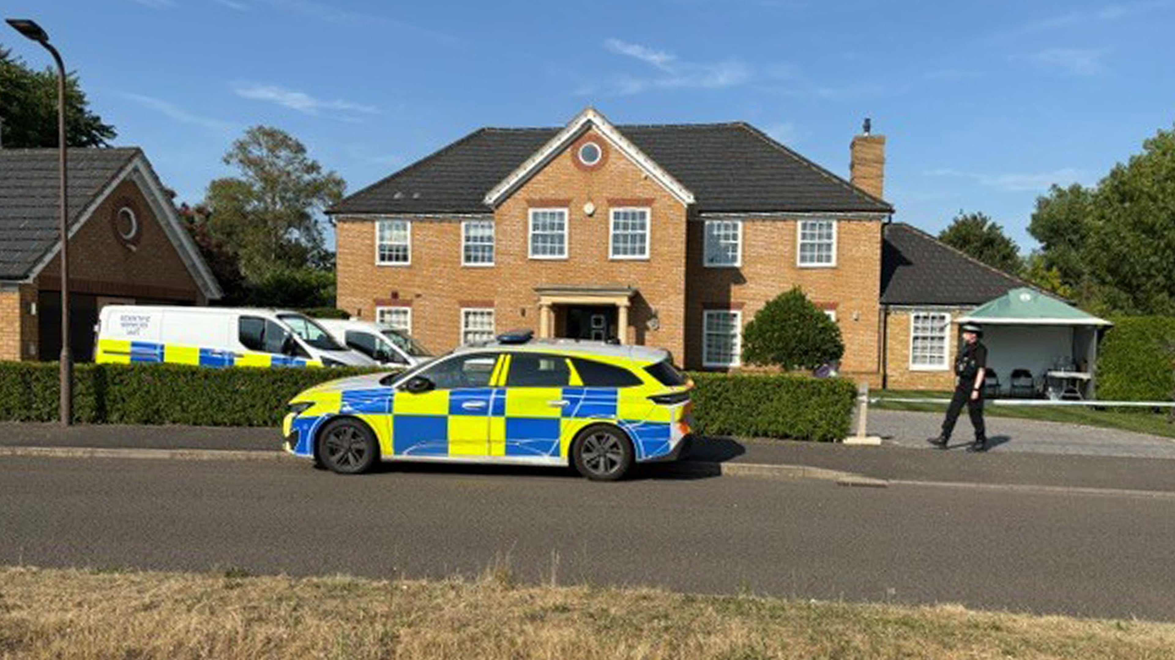 Police find three bodies after suspect flees the country