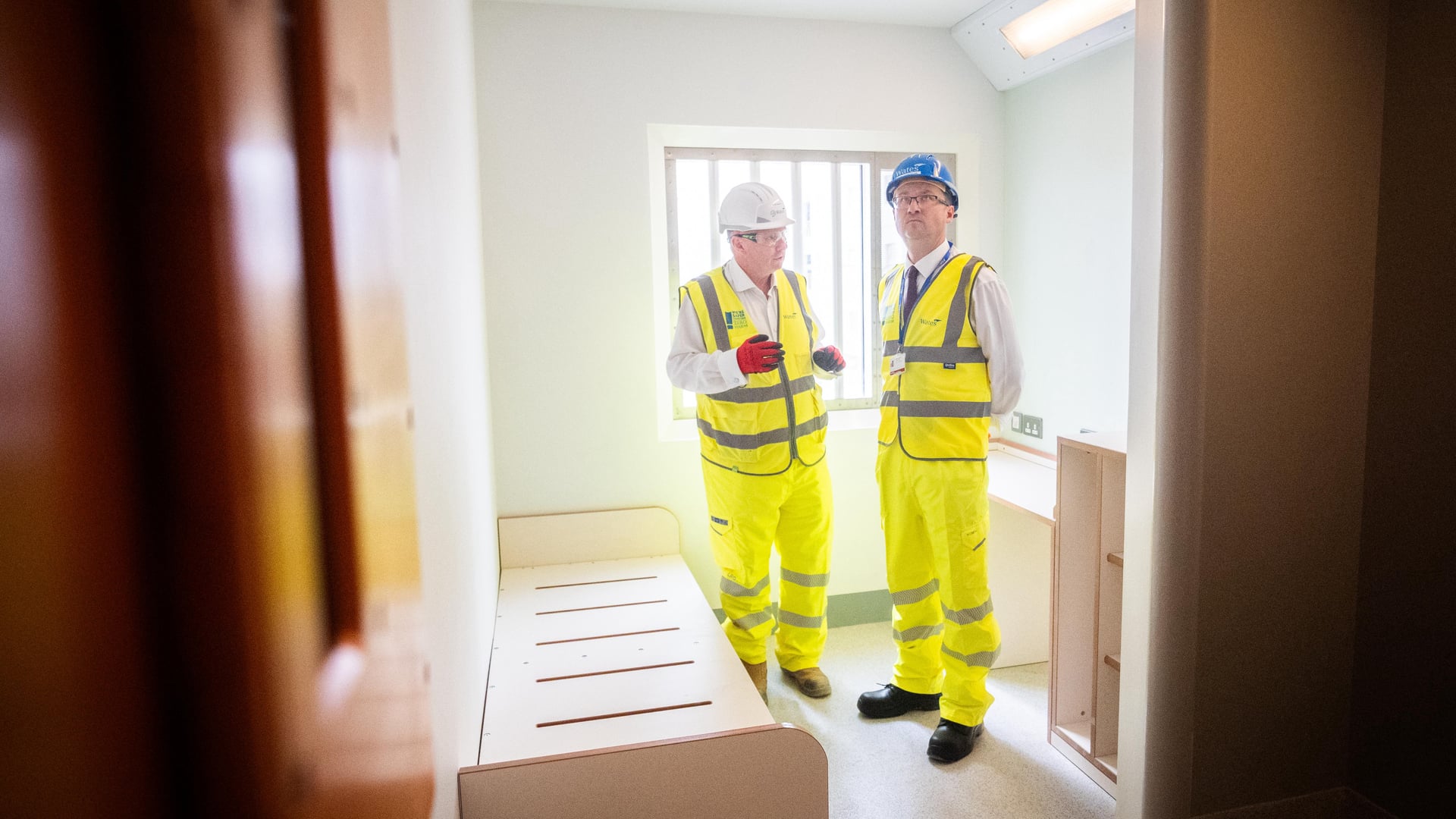 Justice Secretary Alex Norris (right) during a tour of a cell in the site for HMP Welland Oaks (James Manning/PA)
