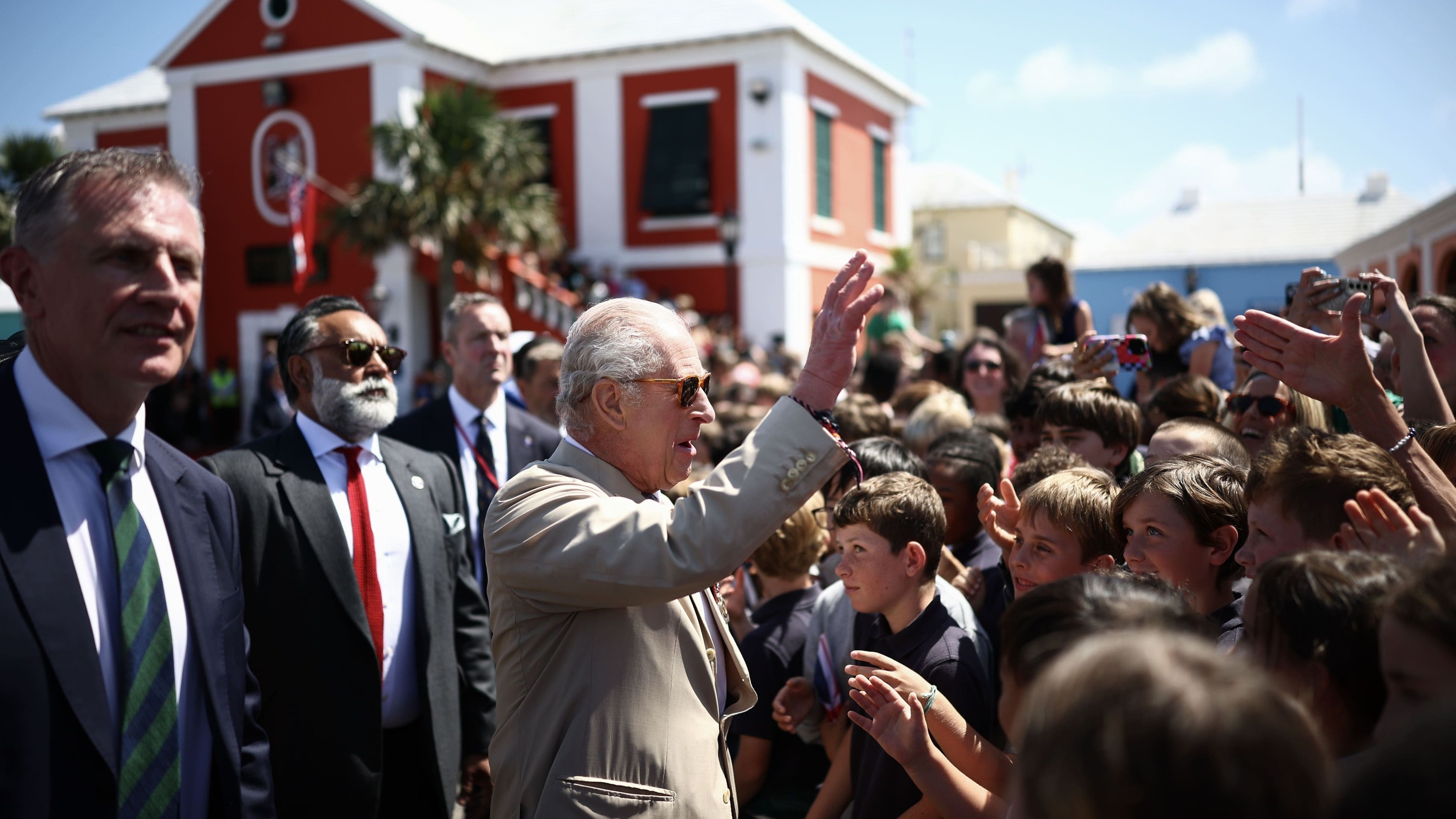 Hundreds of school children and islanders welcome the King to Bermuda