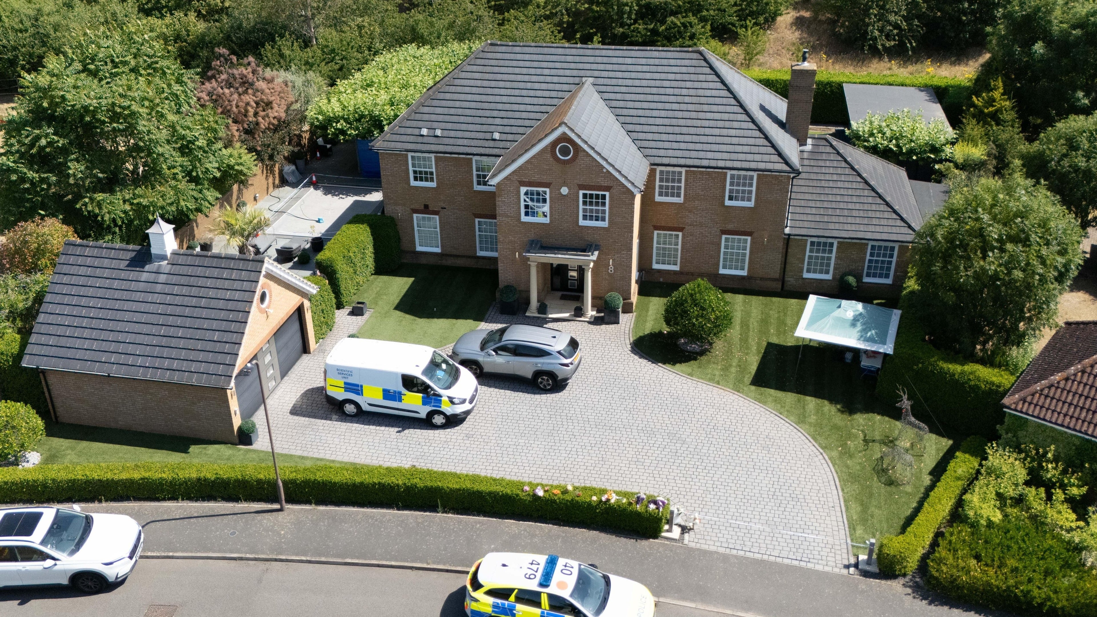 Man wanted over death of wife and daughters in Britain arrested in South Africa