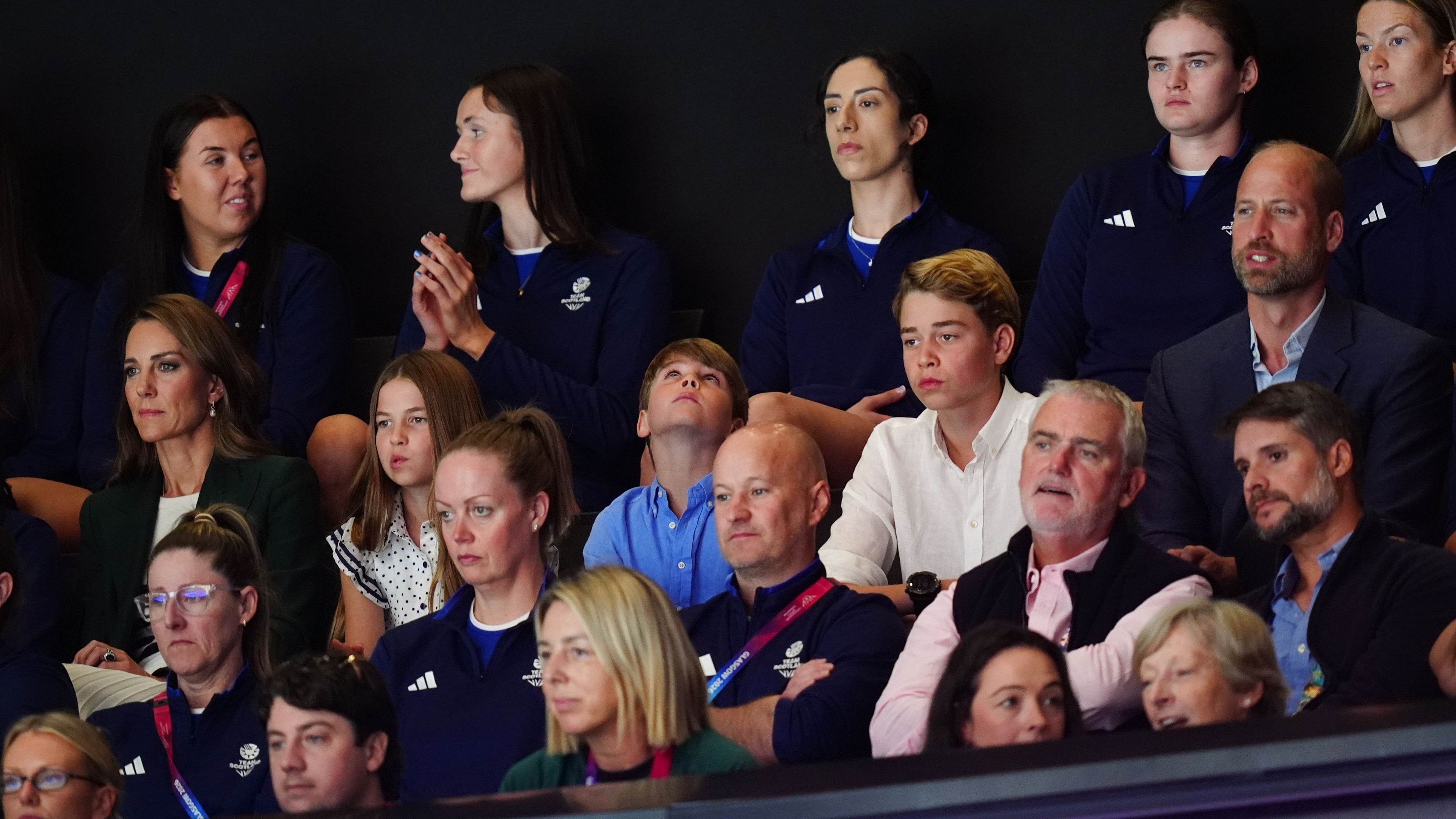 William and Kate joined by children as they watch Commonwealth Games netball