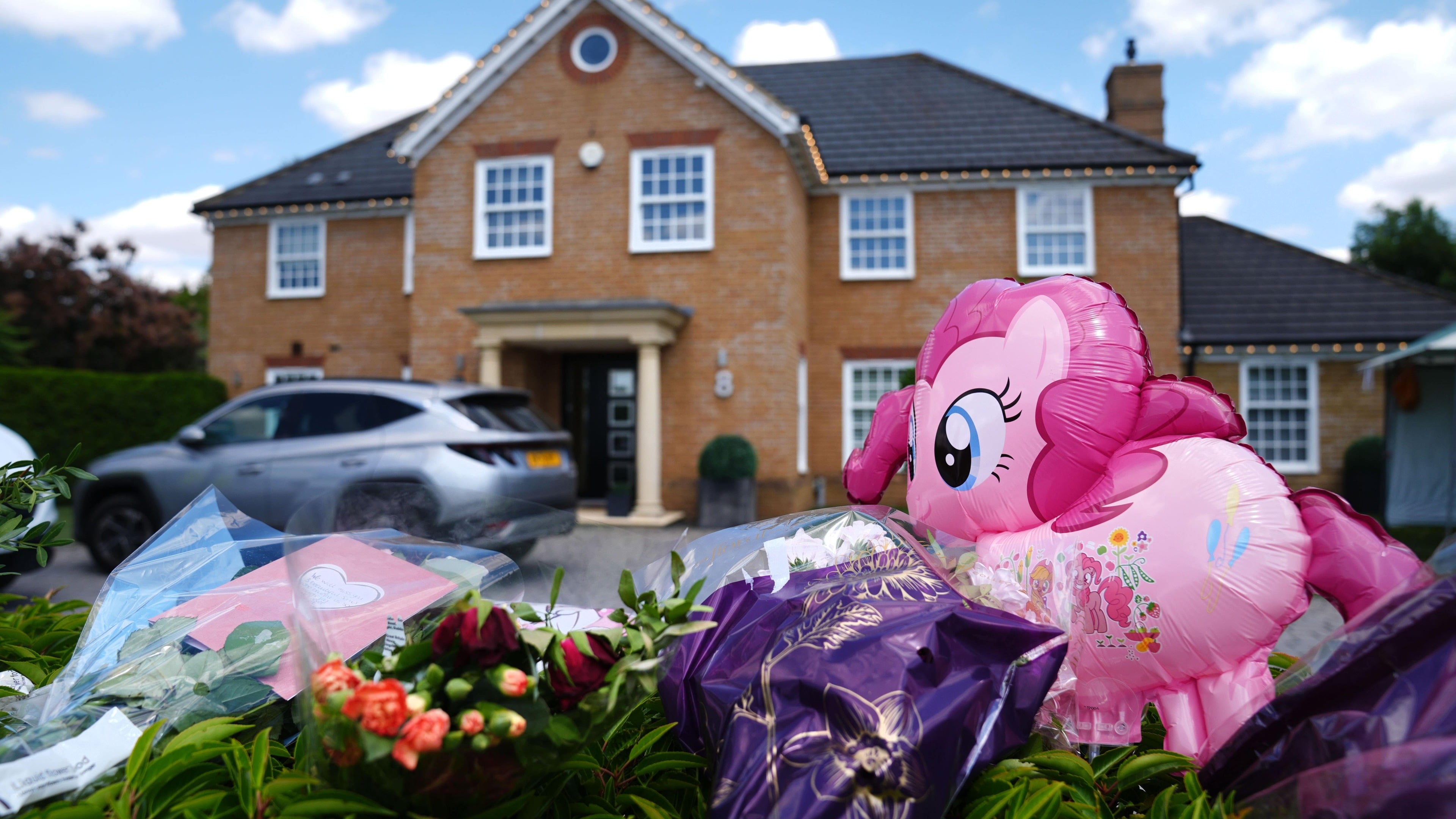 Man charged with triple murder over death of wife and two daughters