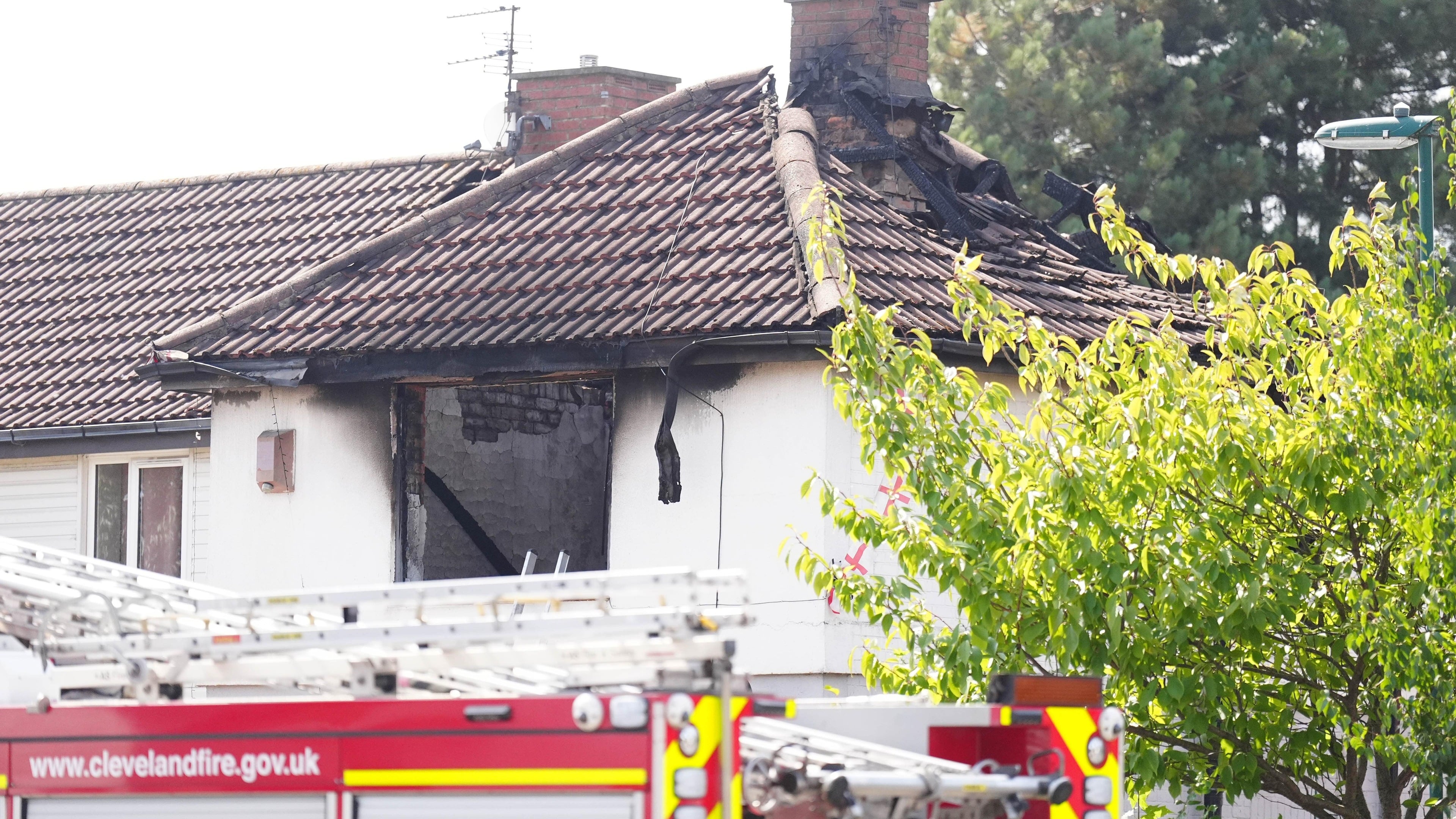 Child confirmed among victims as two arrested after fatal house fire