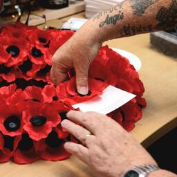 A wreath of poppies being prepared at the launch of the Scottish Poppy Appeal (PA)