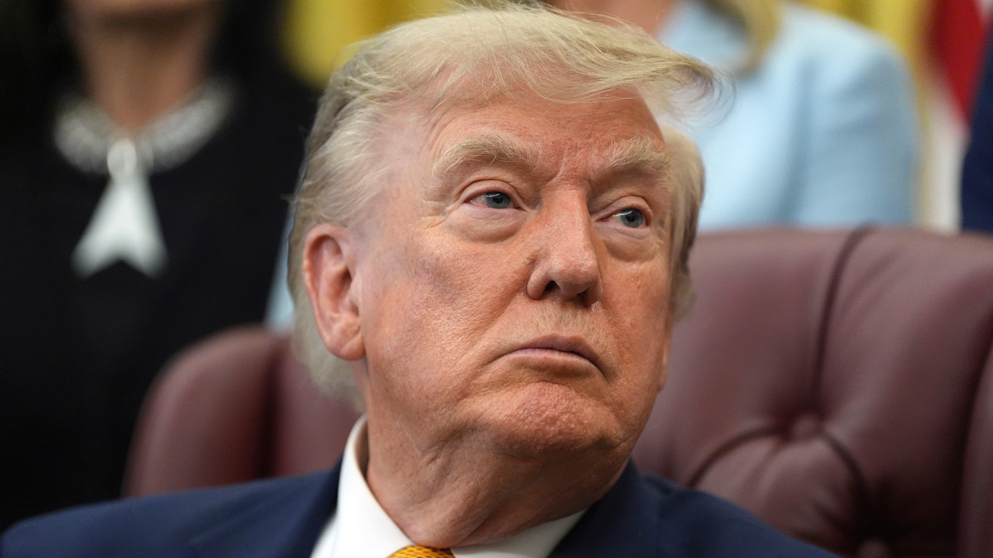 Authorities arrested a man with ammo and apparently monitoring Trump golf course