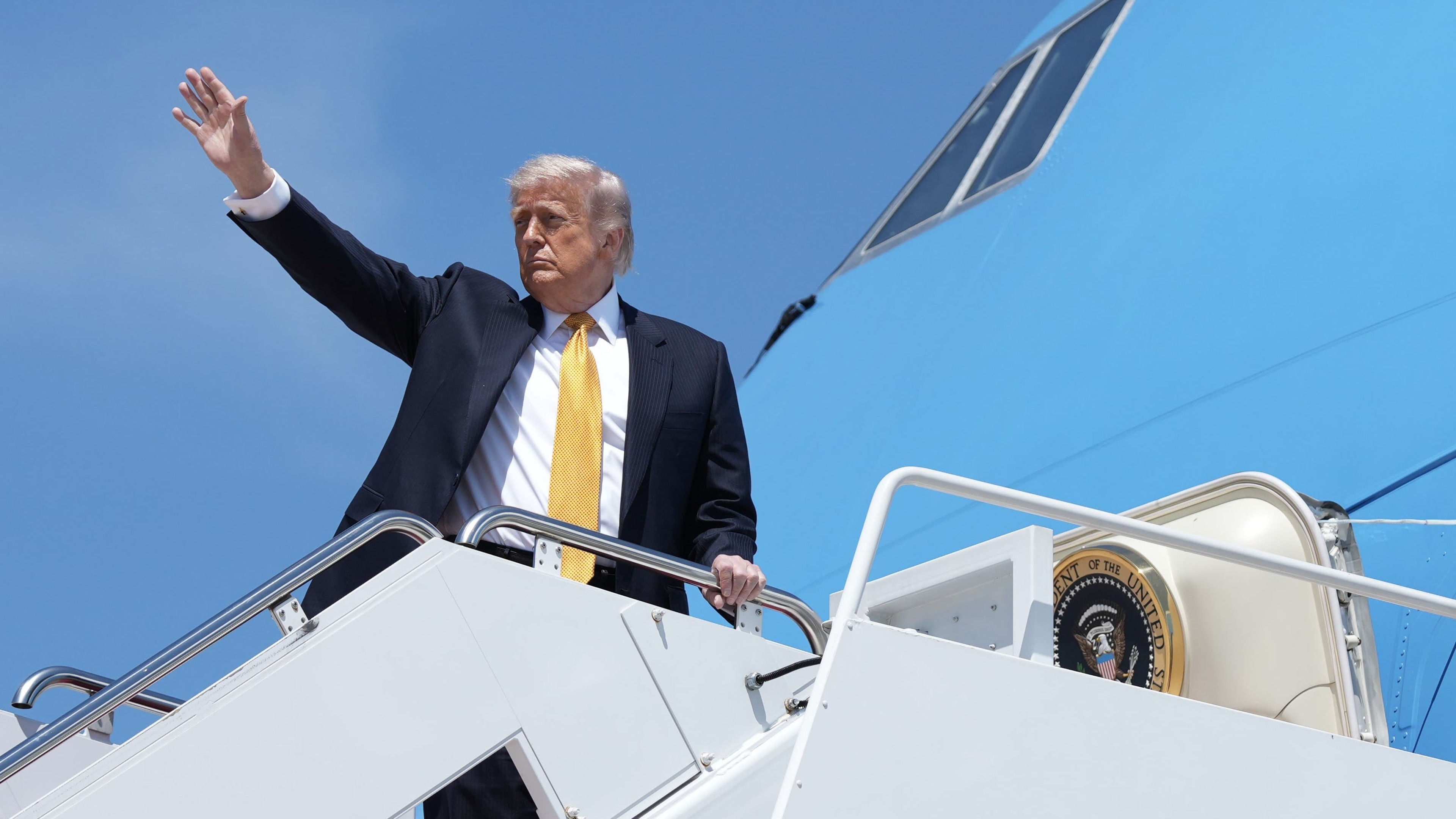 Trump downplays differences with China over Iran as he heads to Beijing