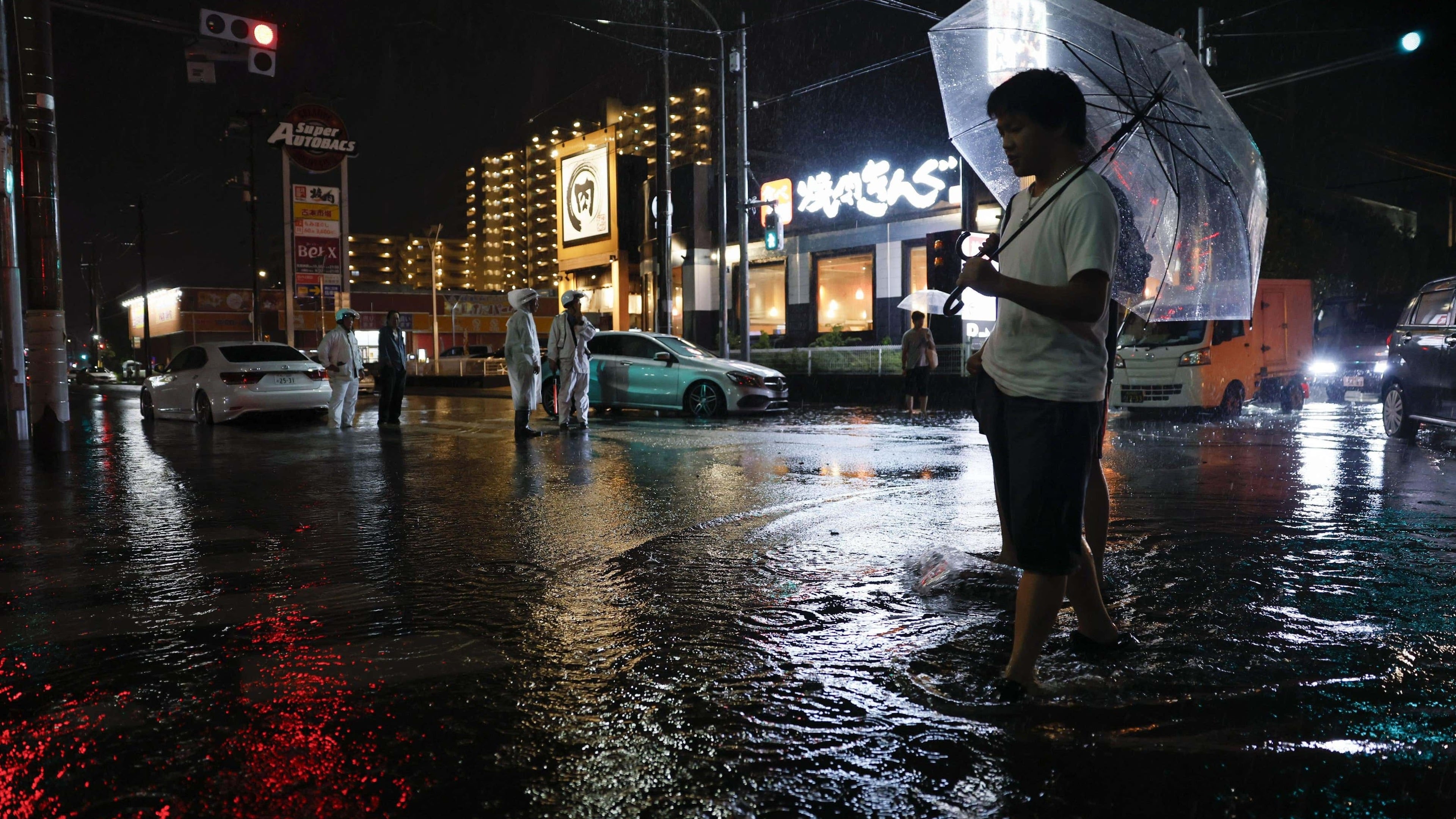 Heavy rain near Tokyo causes deadly floods, disrupts trains and air travel