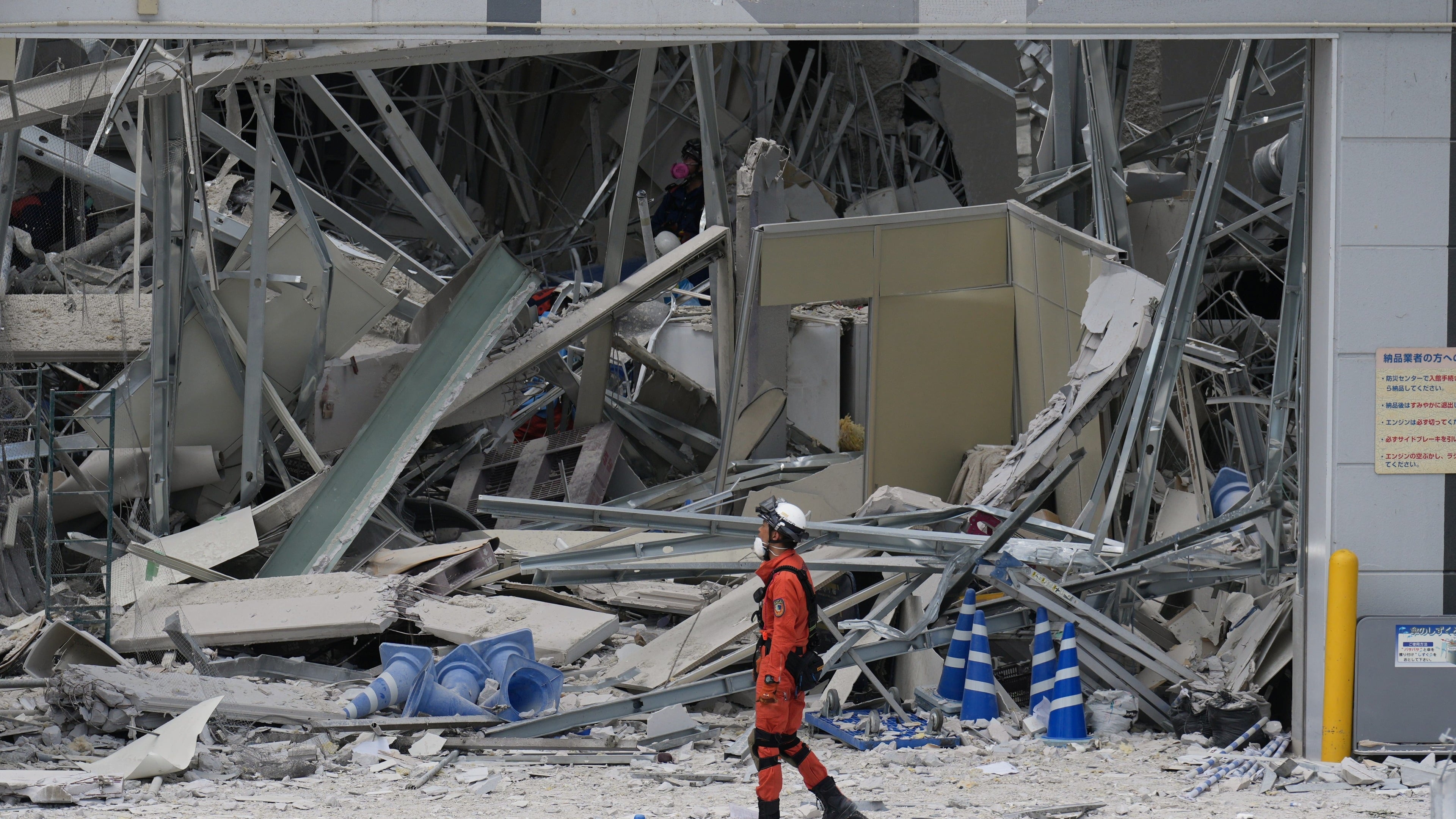 Death toll rises to 18 as rescuers search quake rubble in southwestern Japan