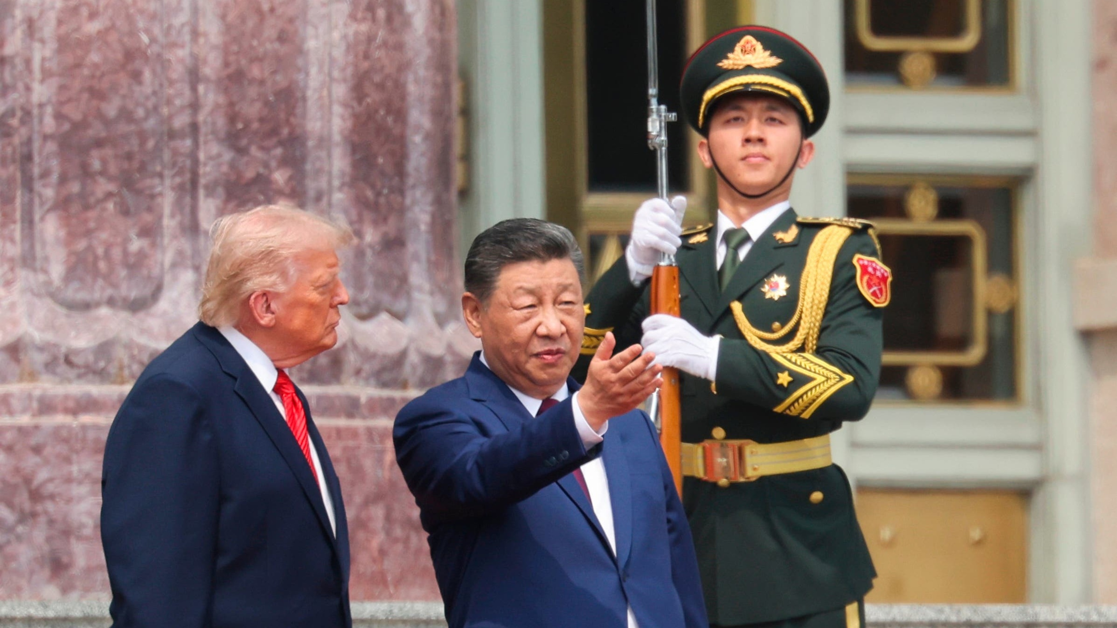 Trump offers friendly words in Beijing while Xi issues cautionary warning