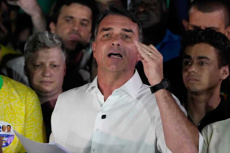 Defeated presidential candidate Flavio Bolsonaro is to be granted a visa to remain in the US (Eraldo Peres/AP)