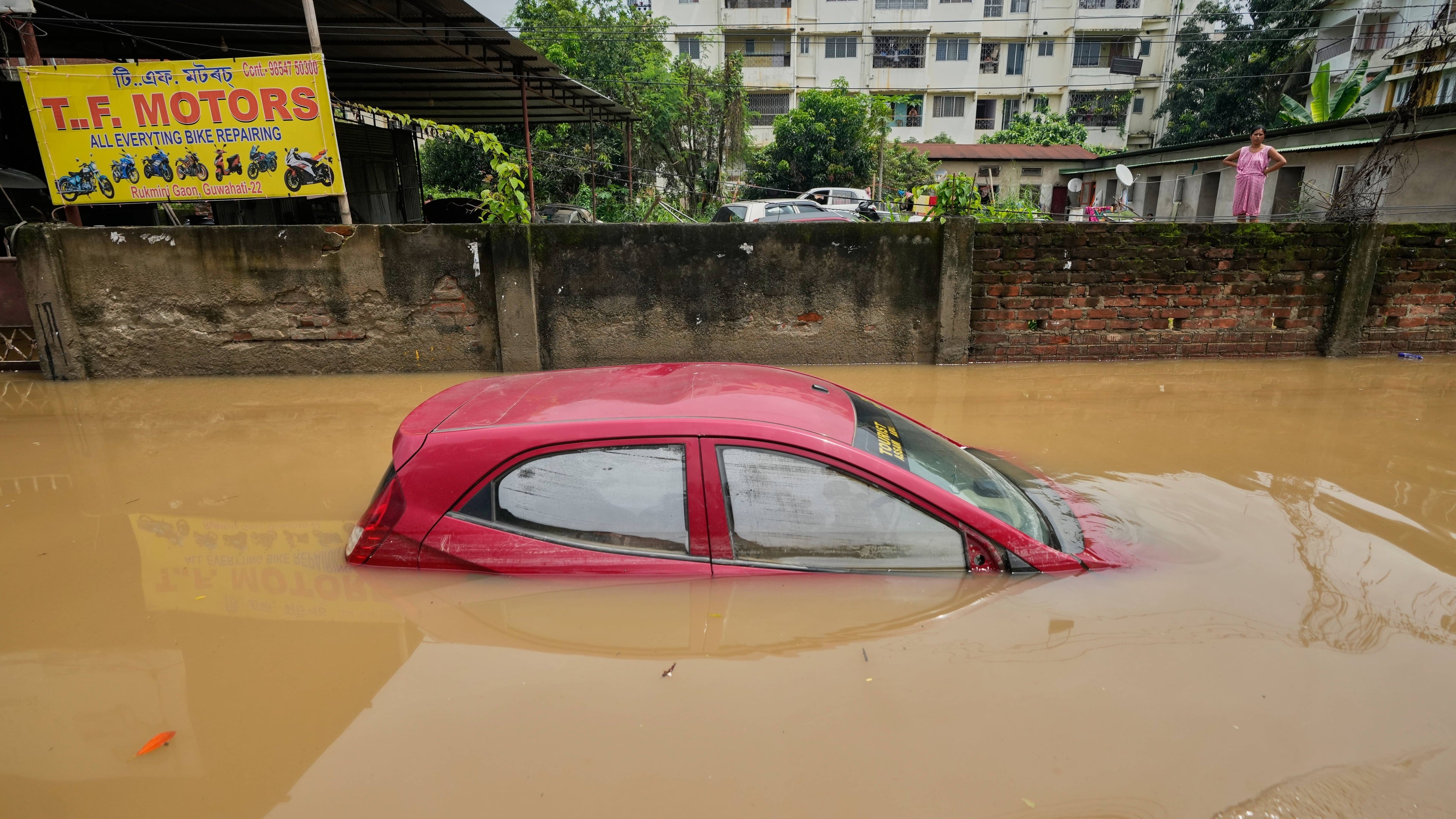 India floods in Assam kill at least 50 and displace about 700,000 after monsoon rains