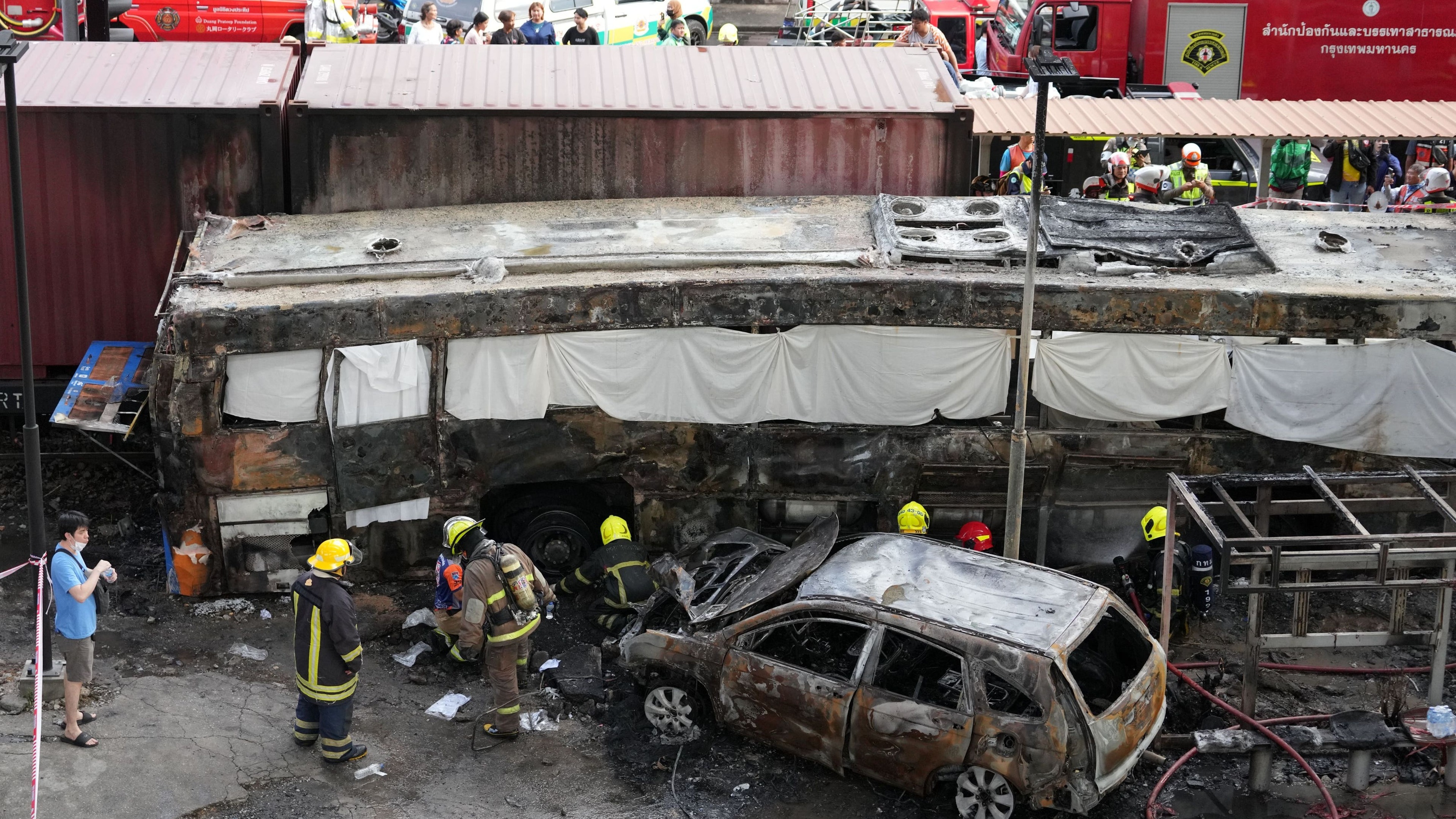 Deadly collision between train and bus in Thai capital