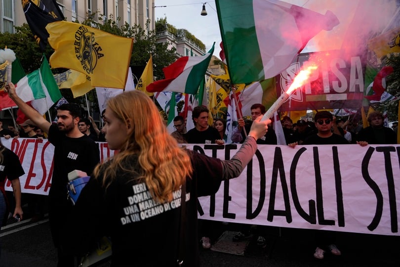Members of right-wing student groups march through the streets of Rome on Saturday (Gregorio Borgia/AP)